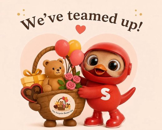 We've teamed up! The Surprise Basket teddy and basket next to the Snoonu mascot
